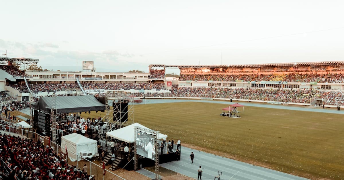 Crowd gathered at a competitive event venue with an electric atmosphere
